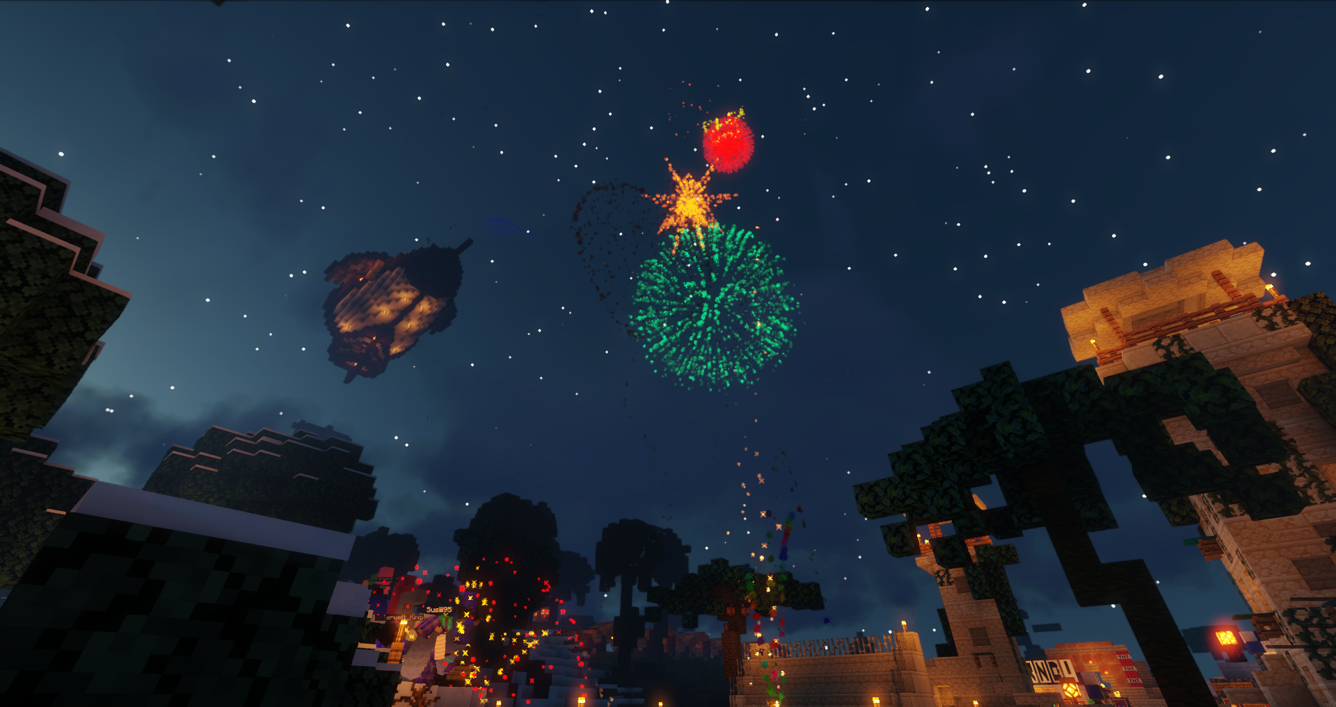 Minecraft Screenshot neben dem Cubeside Spawn. Es ist Nacht. Oben sind bunte Feuerwerkspartikel zu sehen